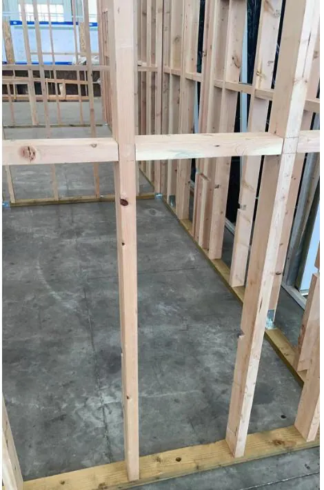 Timber wall frames and floor cassettes being assembled inside the factory